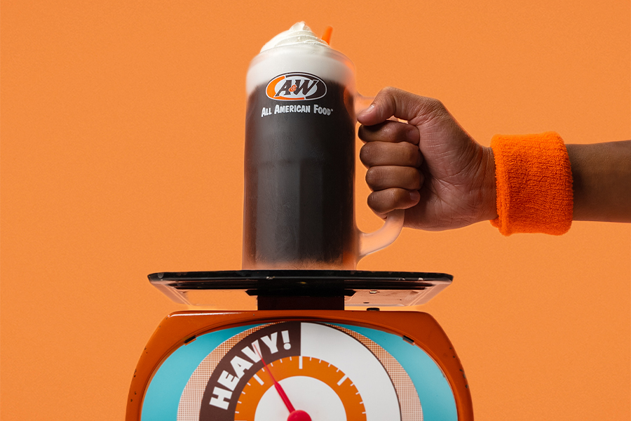 Root Beer Float in an A&amp;amp;W mug being placed on a scale.