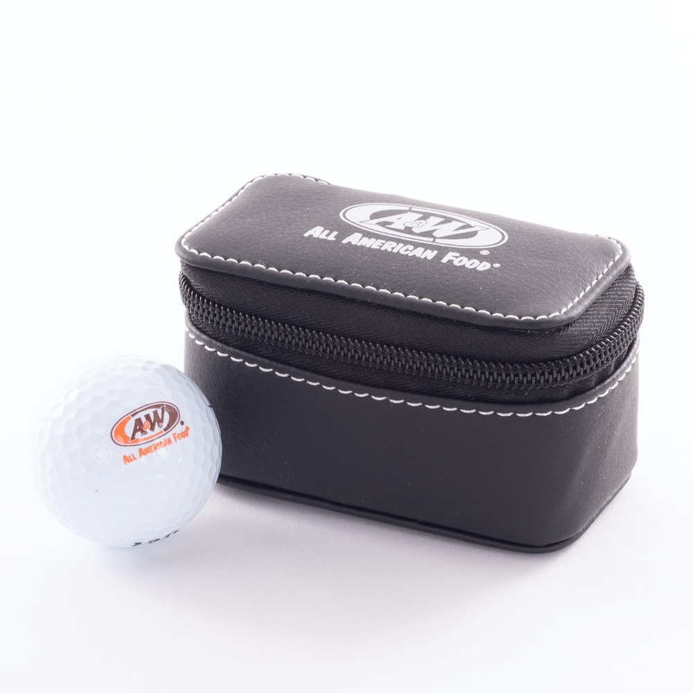 White golf ball imprinted with the A&W Restaurants logo is on the left side of the image. A black golf travel case is on the right side imprinted with the A&W Restaurants logo in white.