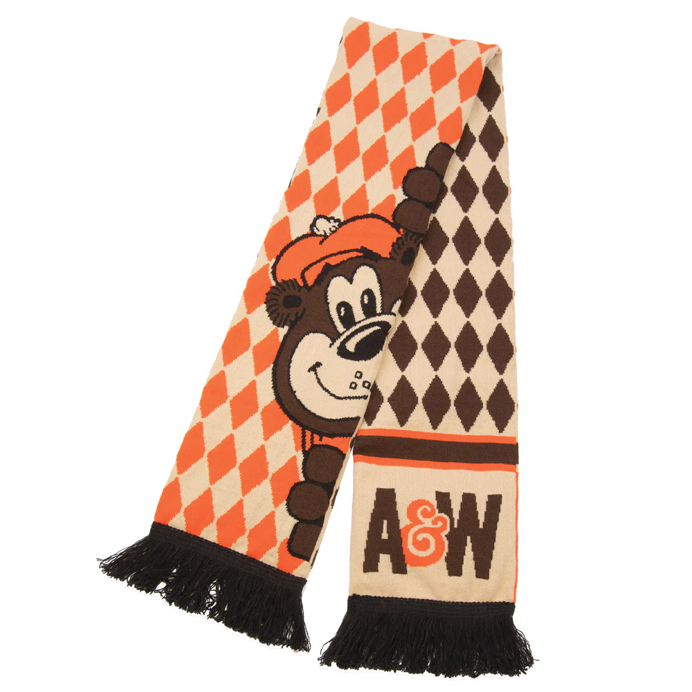 Brown and orange pattern scarf with Rooty the Great Root Bear peeking over side