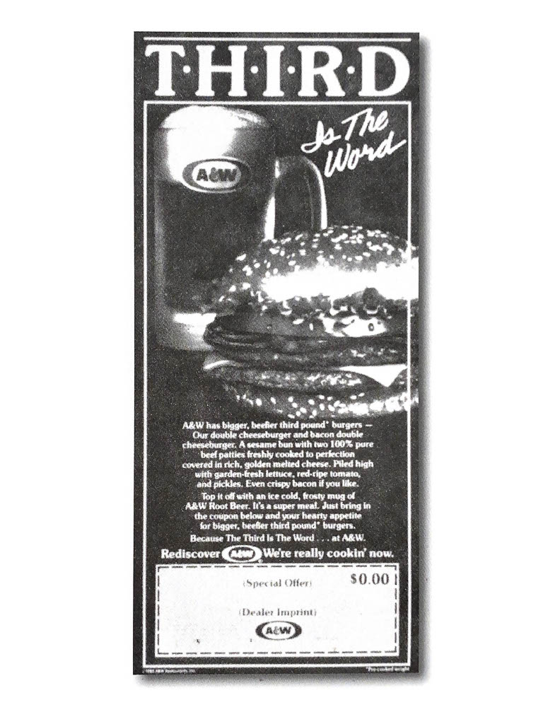 Vintage black and white ad from the 1980s. Text at the top of the ad reads "Third is the Word" with photo of a Burger and mug of A&W Root Beer below the text.