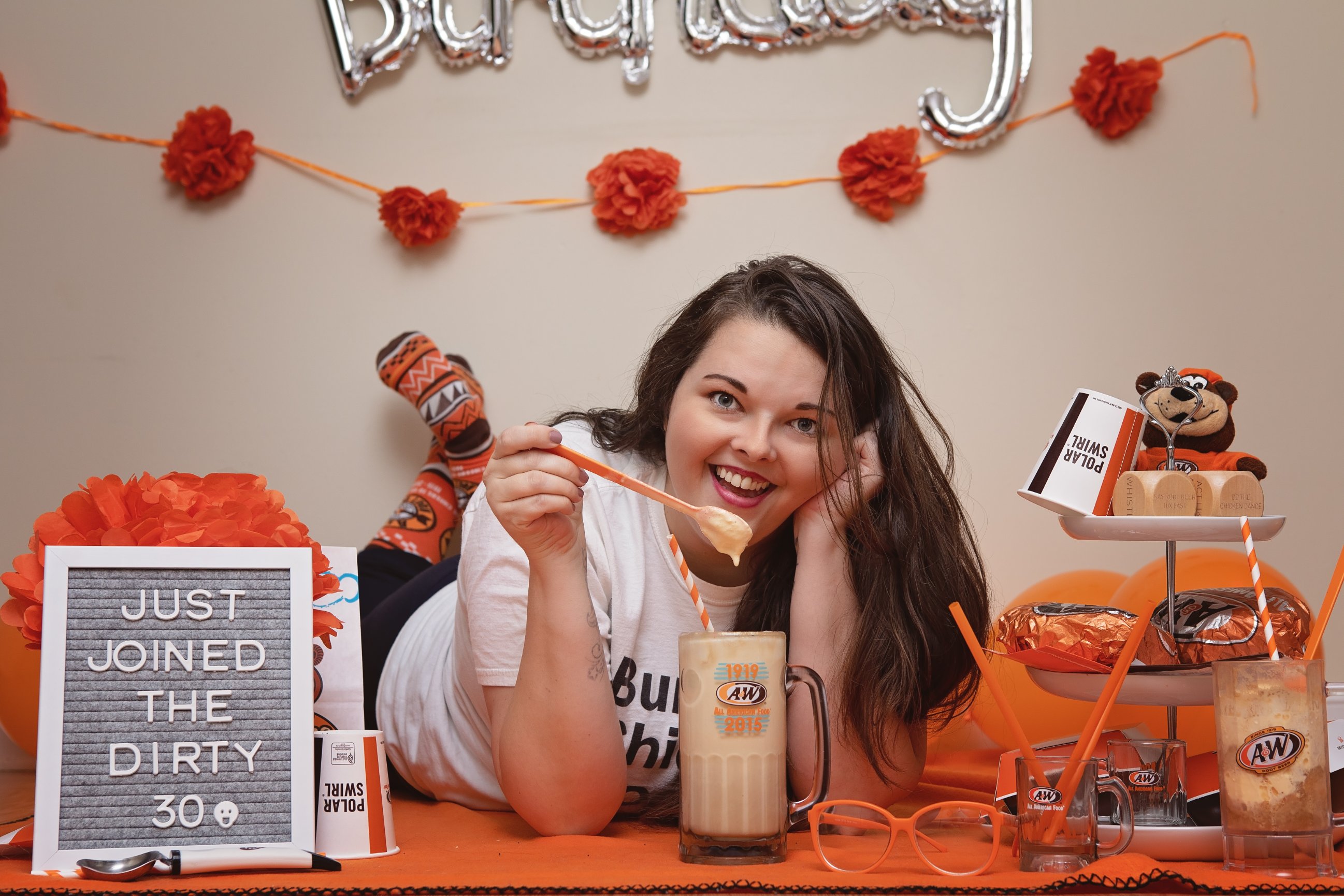 Briana with root beer float in A&W mug